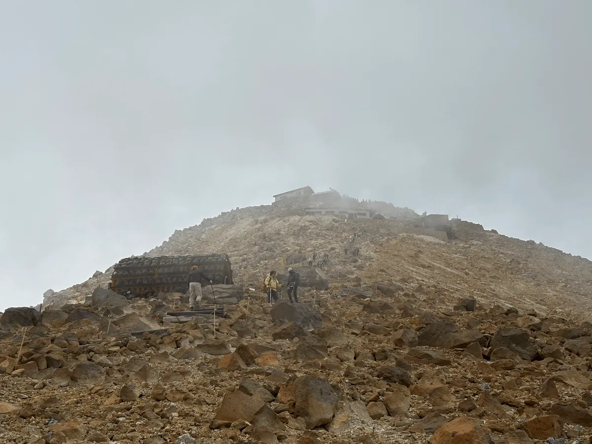 A half-cylindrical shelter in the distance