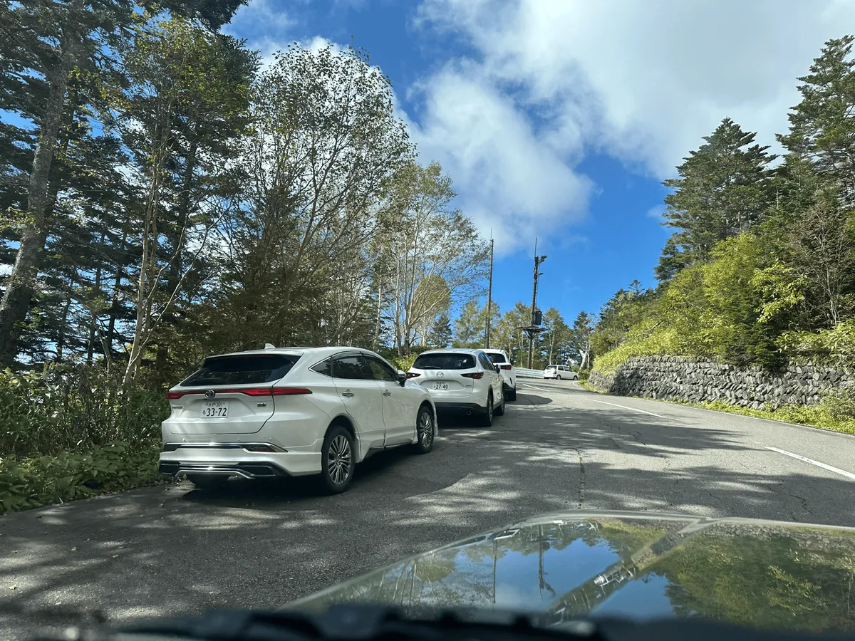 Cars parked on the side of the road.