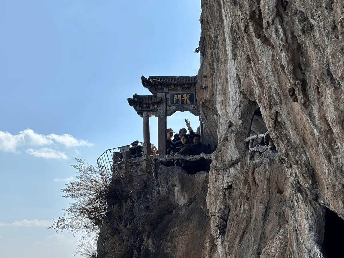 Close-up view of the Dragon Gate carved into the mountain