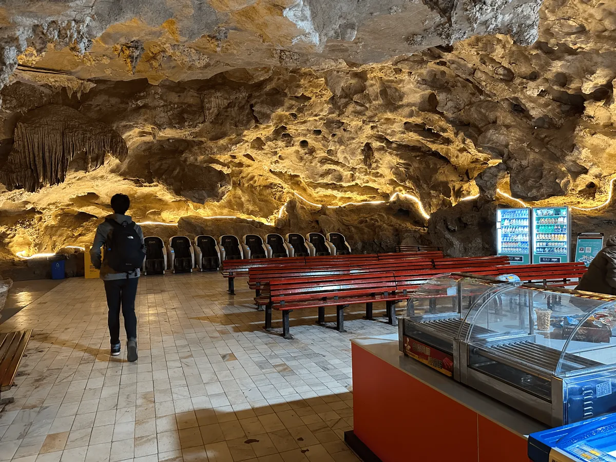 Row of benches and some massage chairs inside the cave