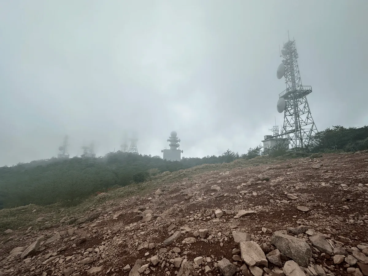 A big rocky summit, again with fog