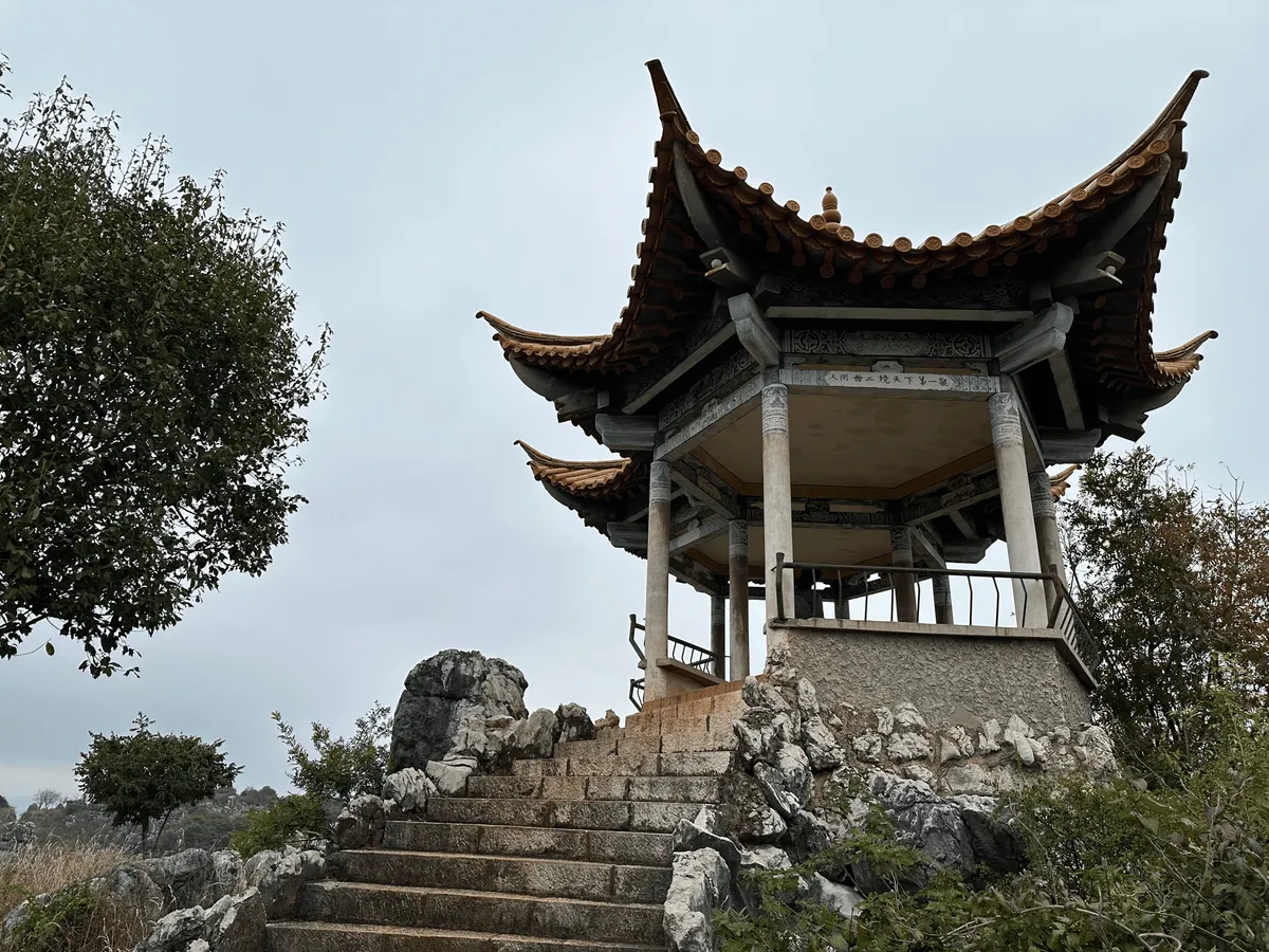 Small pagoda structure among mushroom-shaped rocks