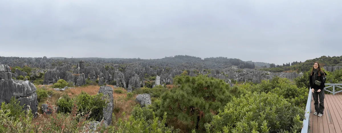 Panoramic photo showing a person multiple times among rock formations