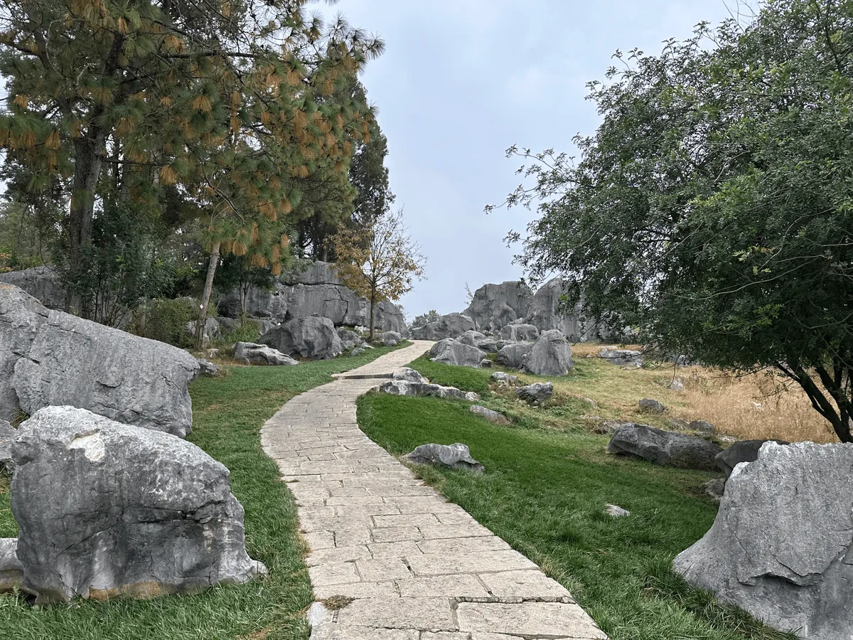 Wide path leading through limestone formations