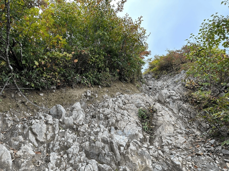 Steep rock climb with some chains you can hold onto