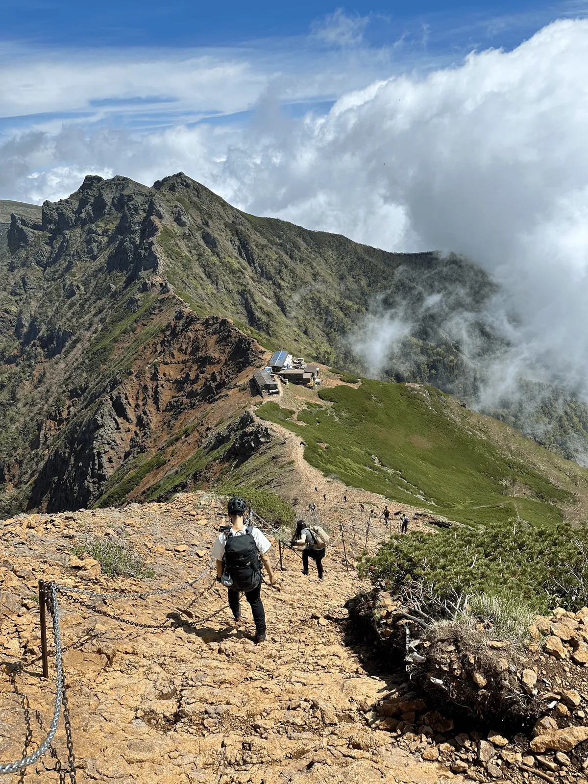 A little hut visible after a steep descent. There's a chain-rope-fence thing you can hold onto