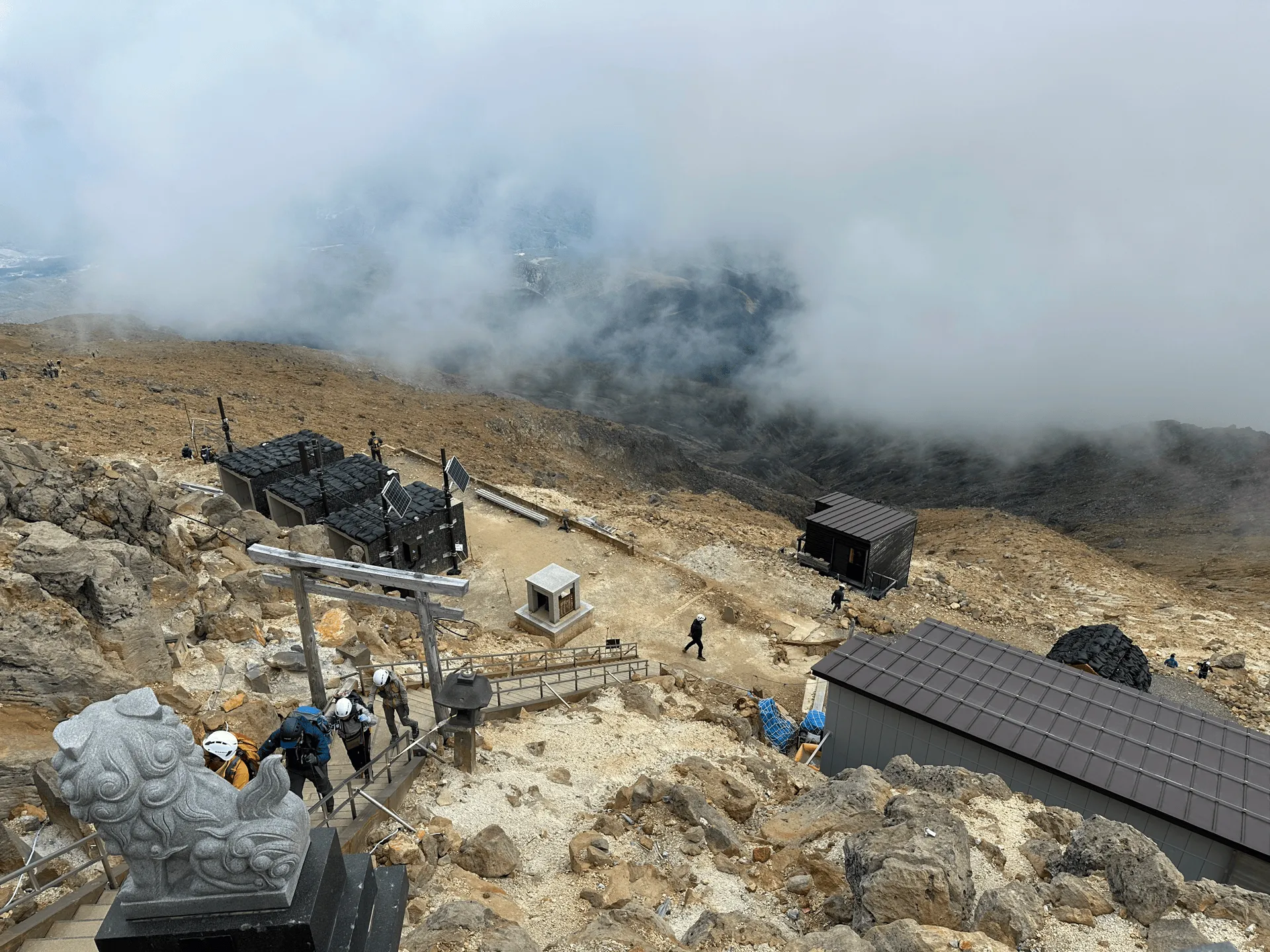 Some proper stairs, like you would see at a shrine, with some shelters visible in the back.
