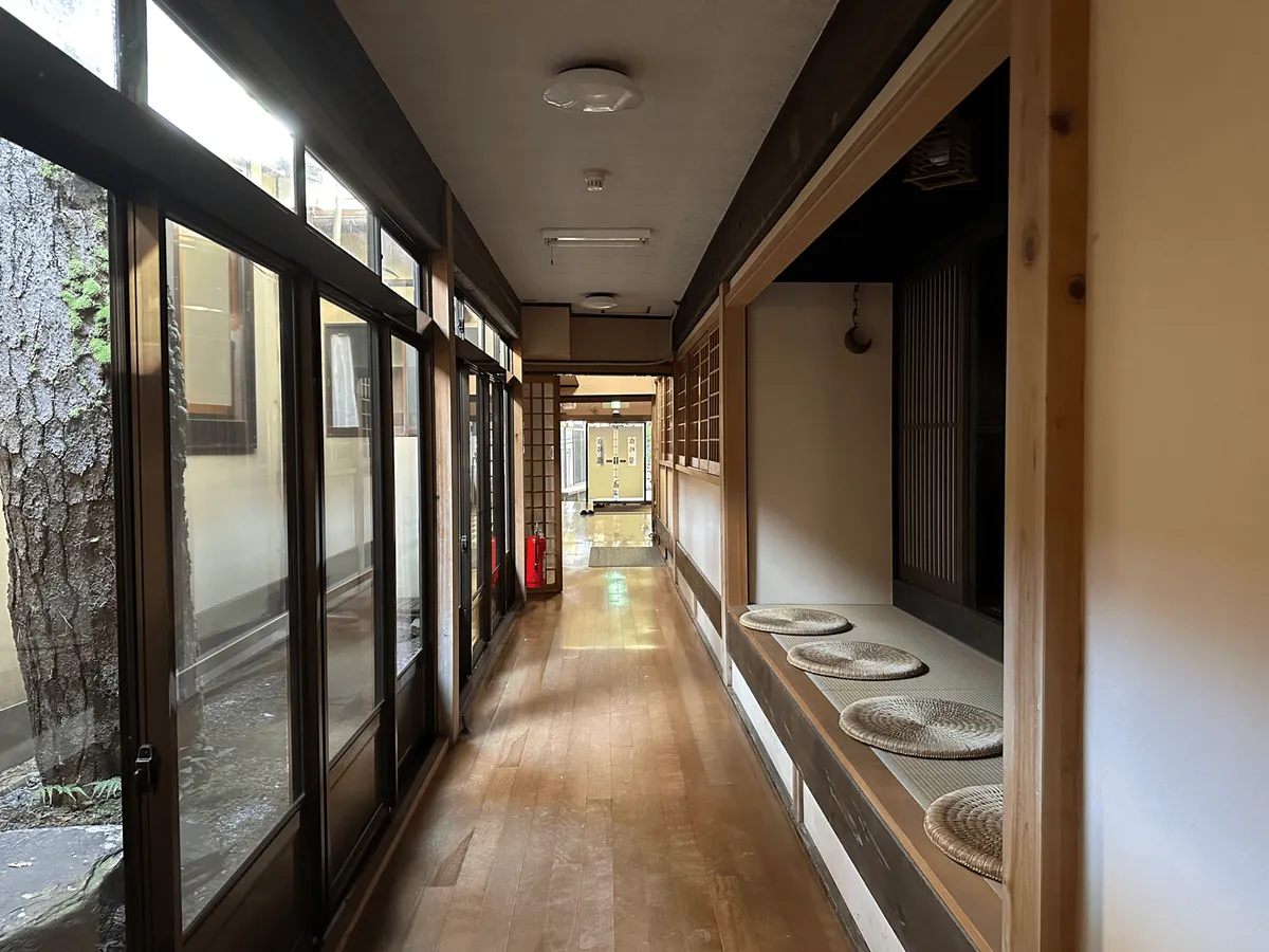 Interior of The Taki Ryokan, a long wooden corridor